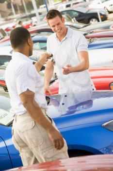 Royalty Free Photo of a Man Shopping for a New Car