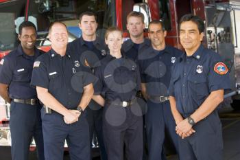 Royalty Free Photo of Firefighters in Front of a Truck