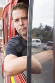 Royalty Free Photo of a Firefighter in the Truck