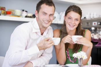 Royalty Free Photo of a Young Couple Drinking Tea
