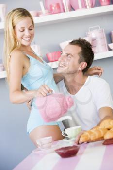 Royalty Free Photo of a Man and Woman Having Breakfast