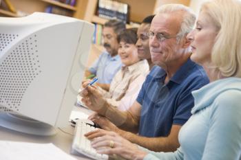 Royalty Free Photo of People at Computer Terminals