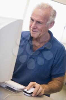 Royalty Free Photo of a Man at a Computer
