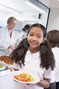 Royalty Free Photo of a Girl With Food in a Cafeteria
