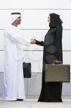 Royalty Free Photo of Two Arabian Businesspeople Shaking Hands