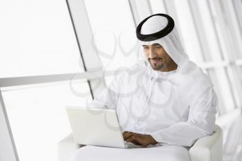 Royalty Free Photo of a Man With a Laptop