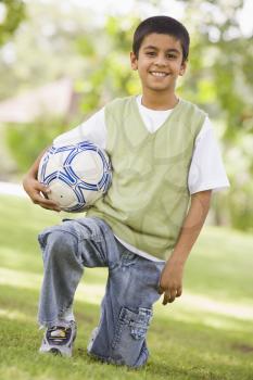 Royalty Free Photo of a Boy With a Soccer Ball