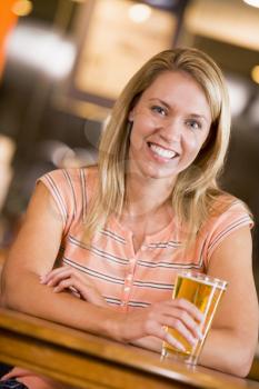Royalty Free Photo of a Woman Having a Glass of Beer