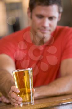 Royalty Free Photo of a Man Having a Glass of Beer