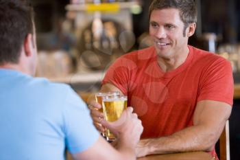 Royalty Free Photo of Two Men Having a Beer