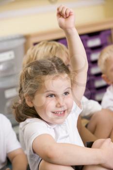 Royalty Free Photo of a Girl Raising Her Hand in Class