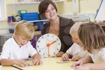 Royalty Free Photo of a Teacher Teaching Time