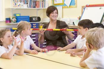 Royalty Free Photo of a Teacher and Student With a Counting Stick