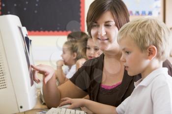 Royalty Free Photo of a Teacher and Student in Computer Class