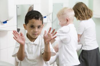 Royalty Free Photo of Students Washing Their Hands