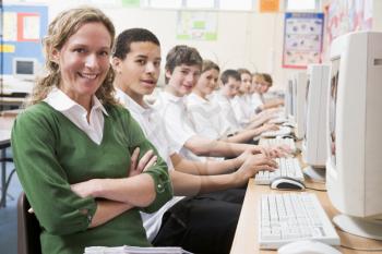 Royalty Free Photo of a Teacher and a Computer Class