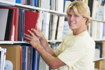 Royalty Free Photo of a Guy in a Library