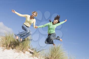 Royalty Free Photo of Two Girls Jumping