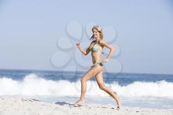 Royalty Free Photo of a Girl Running on the Beach