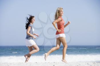 Royalty Free Photo of Women Jogging on a Beach