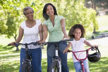 Royalty Free Photo of Three Generations of Women on Bikes