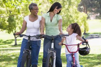 Royalty Free Photo of Three Generations of Females on Bikes