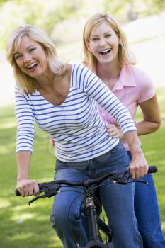 Royalty Free Photo of Two Friends on a Bike