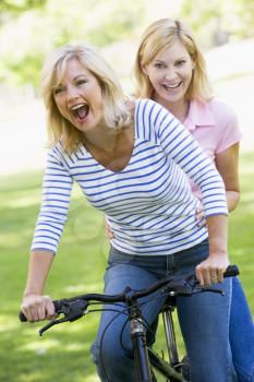 Royalty Free Photo of Two Friends on a Bike