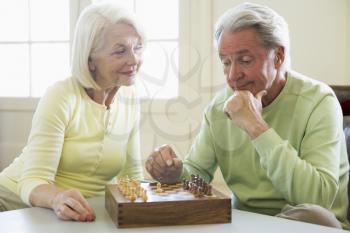 Royalty Free Photo of a Couple Playing Chess