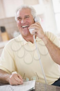 Royalty Free Photo of a Man on the Telephone Laughing