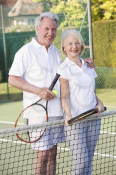 Royalty Free Photo of a Couple Playing Tennis