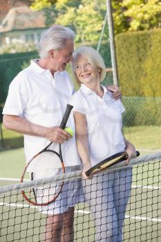 Royalty Free Photo of a Couple With Tennis Rackets