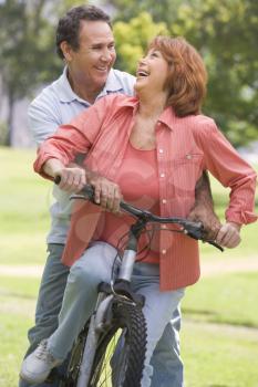 Royalty Free Photo of a Couple on a Bike