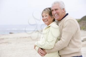 Royalty Free Photo of a Couple Embracing at the Beach