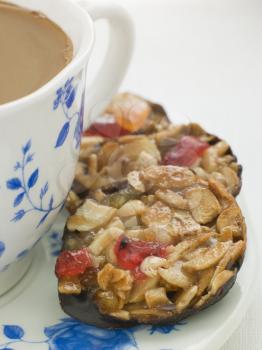 Royalty Free Photo of Petit Florentines With a Cup of Tea