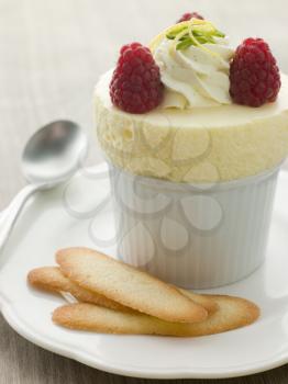 Royalty Free Photo of Chilled Lemon Souffle With Langue de Chat Biscuits