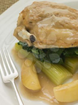 Royalty Free Photo of Chicken Breast and Celery Cooked in a Cider Sauce