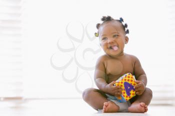Royalty Free Photo of a Baby With a Toy Block