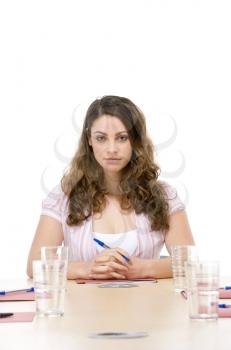 Royalty Free Photo of a Woman Sitting in a Board Room