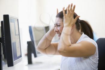 Royalty Free Photo of an Angry Woman at a Computer