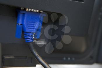 Royalty Free Photo of a Cable Plugged Into a Computer Monitor