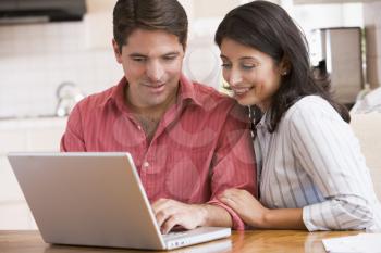 Royalty Free Photo of a Couple at a Laptop