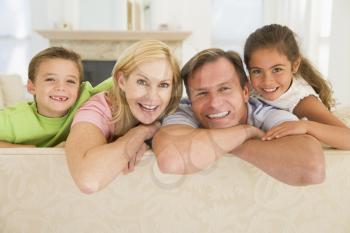 Royalty Free Photo of a Family Leaning on a Couch