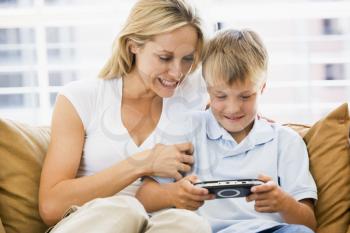 Royalty Free Photo of a Mother and Son With a Video Game Controller