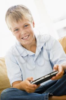 Royalty Free Photo of a Young Boy Playing Video Games