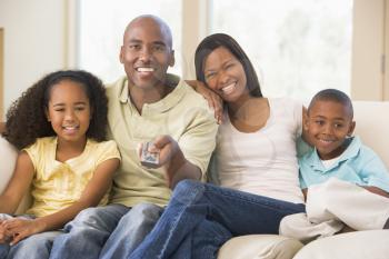 Royalty Free Photo of a Family Watching Television