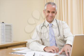 Royalty Free Photo of a Doctor using a Laptop