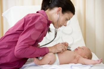 Royalty Free Photo of a Doctor With a Baby