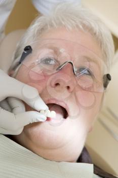 Royalty Free Photo of a Woman in a Dentist's Chair