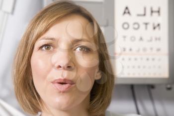 Royalty Free Photo of a Woman Getting an Eye Exam